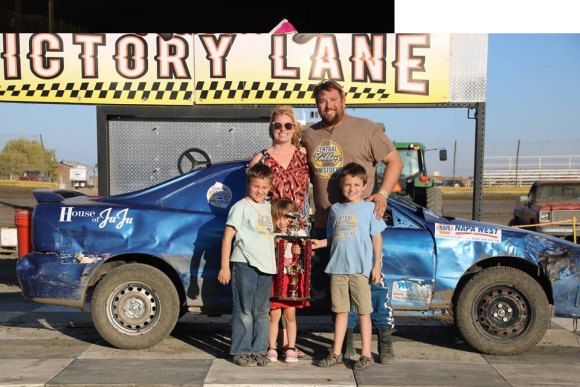 Winner Dan Myrick and his family celebrate after his mini-stock win Sunday at the Lemoore Raceway.